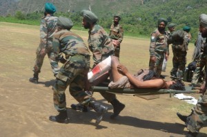 Soldiers evacuate one of the men injured by the mid-June flash floods near Kedarnath (Photo by Sanjay Semwal)
