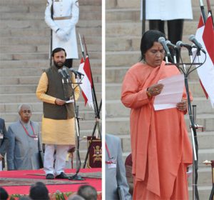 <p>Prakash Javadekar (left) and Uma Bharti (right) take oath as ministers (Images by Press Information Bureau, Government of India)</p>