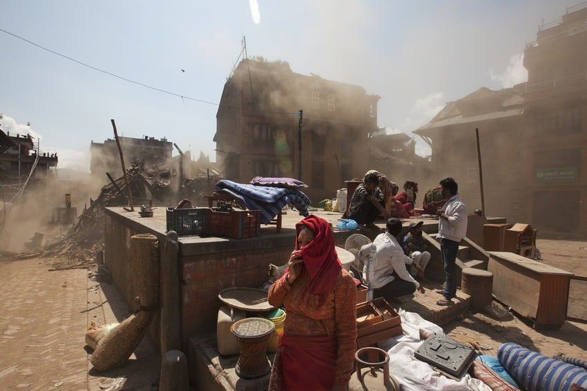 <p>Volunteers clear rubble at the Basantapur Durbar square in Kathmandu. (AFP/Nicolas Asfouri)</p>