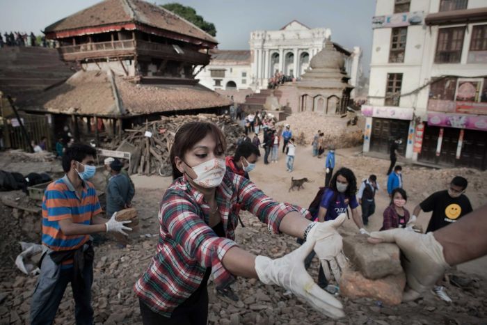 <p>PHOTO: Volunteers continue to clear rubble at the Basantapur Durbar square in Kathmandu. (AFP/Nicolas Asfouri)</p>