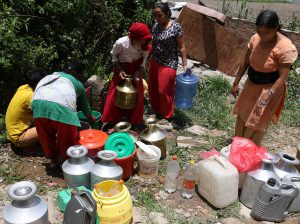 <p>Locals wait for their turn to fill their buckets at Kirtipur. They say supply of drinking water on taps has decreased after the quakes. (Photo: Riwaj Rai)</p>
