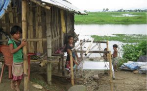 <p>Children in Assam&#8217;s flooded landscape [image by Mubina Akhtar]</p>