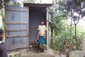 <p>A family in Sirajganj district in Bangladesh installing sanitary latrine [image by Development Organization for the Rural Poor] </p>