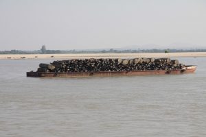 <p>A picture from 2011 of teak logs being floated down the Irrawady [image by Terry Feuerborn]</p>