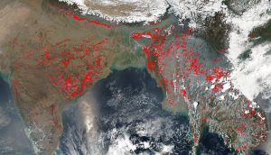 <p>A satellite image of agricultural fires raging across southern Asia [Photo by Jeff Schmaltz / NASA]</p>