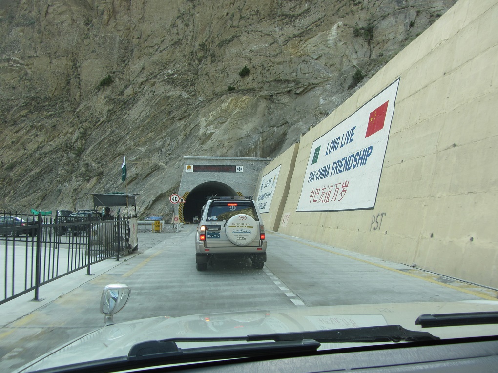 Cars driving through the tunnels built by Chinese above Atabad Lake [image by: Rina Saeed Khan]