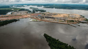 <p>The Belo Monte Dam under construction on the Xingu River, a tributary of the Amazon, in 2015 (image: <a href="http://e360.yale.edu/features/how-a-dam-building-boom-is-transforming-the-brazilian-amazon" target="_blank" rel="noopener">FabioNascimento/Greenpeace </a>)</p>
