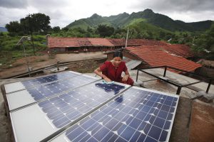 <p>A solar engineer trained under a DfID programme in Tinginaput, India [image by: DfiD]</p>