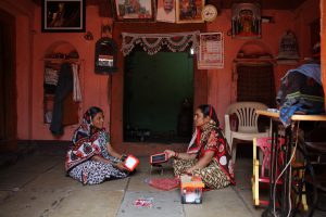 Two women with solar powered lights