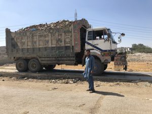 <p>Mohammad Bilal makes two trips from Sharafi goth garbage transfer station to to Jam Chakro landfil site carrying approximately  26 tonnes of waste [image by: Zofeen T Ebrahim]</p>