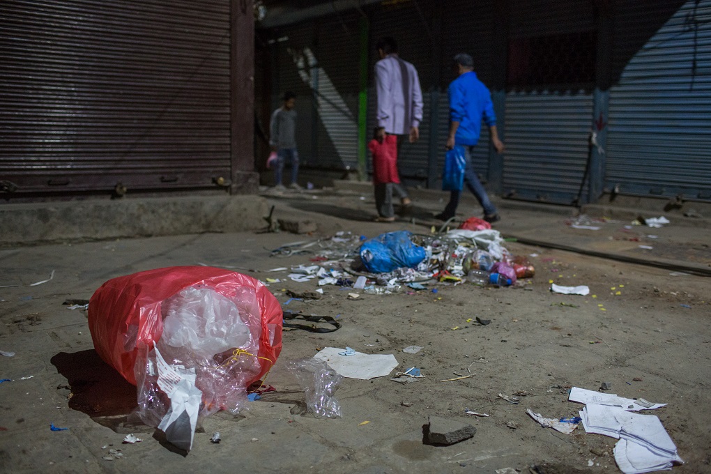 <p>A dysfunctional waste management system means that plastic refuse is never fully cleared away [image by: Nabin Baral] </p>
