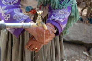 <p>A woman washes her hands in Koari Laguna, Bolivia (image: <a href="https://www.flickr.com/photos/wateradvocates/1477032361" target="_blank" rel="noopener">Water for People/ Kate Fogelburg</a>)</p>