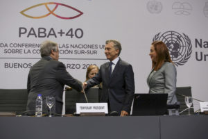 <p>Argentina&#8217;s president Mauricio Macri greets UN Secretary General Antonio Guterres and General Assembly President María Fernanda Espinosa (image: <a href="https://www.flickr.com/photos/unossc/47375902332/in/album-72157704151869092/">UNOSSC</a>)</p>