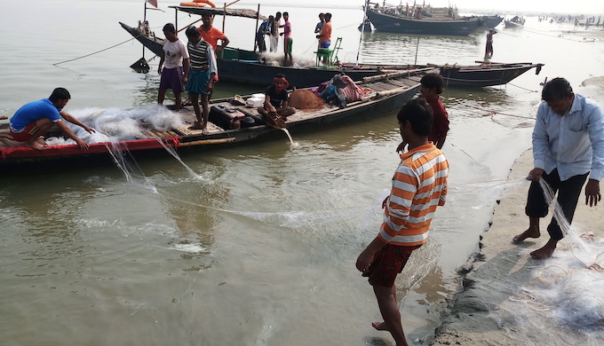 Men fishing in the Ganga. Many complain of dwindling catch due to hot water discharge from Farraka super thermal power plant