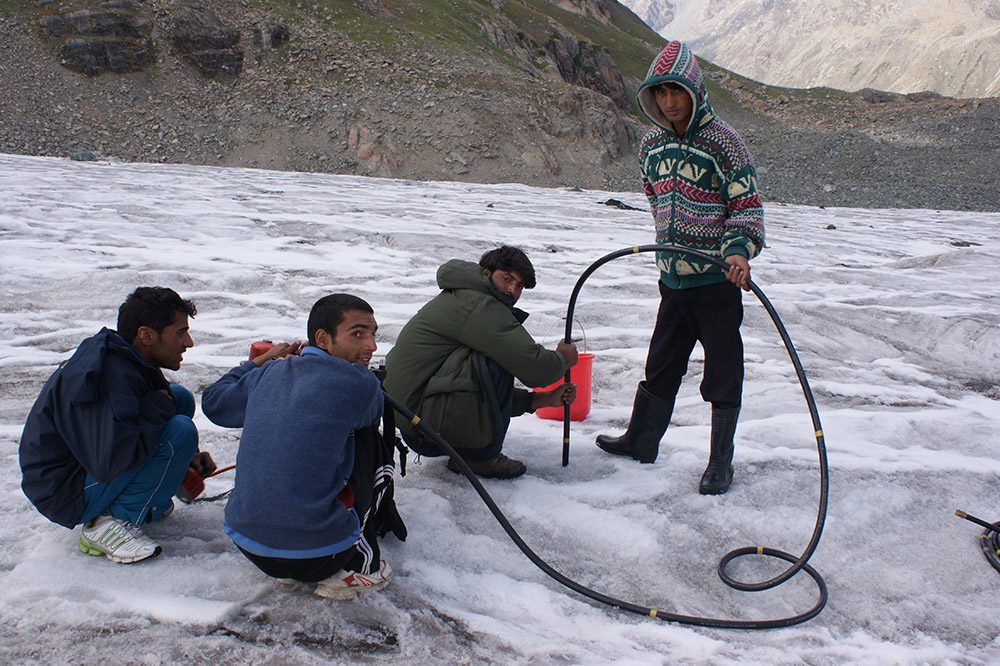 A steam driller machine-is used to insert bamboo sticks which help calculate the thickness of the glacier