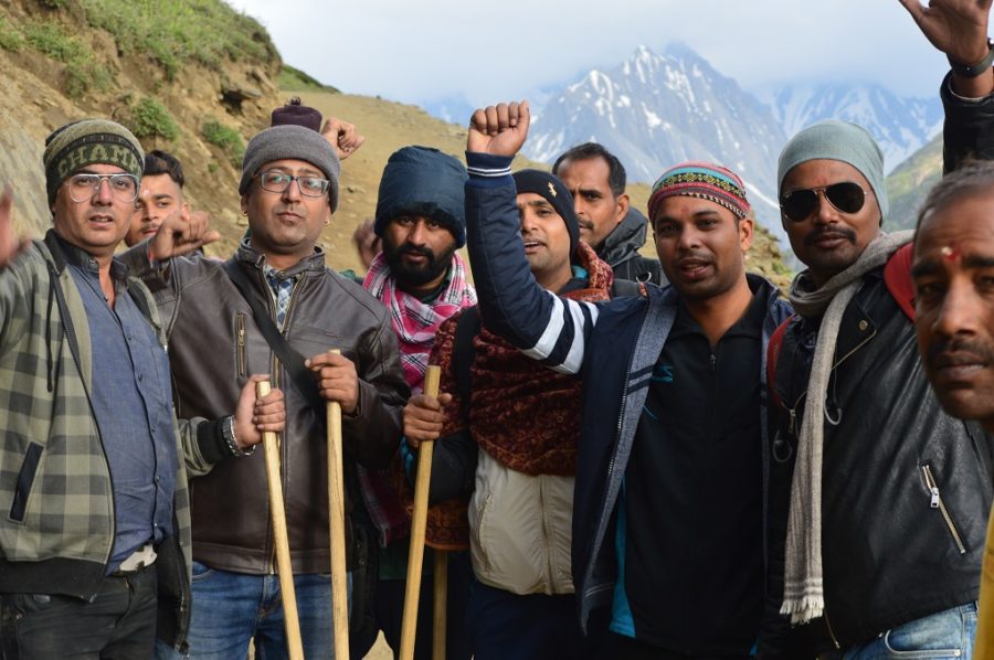 Pilgrims raising slogans to celebrate the completion of their pilgrimage. These pilgrims, however, said that they found the pollution along the Yatra tracks quite disturbing [image by: Athar Parvaiz]