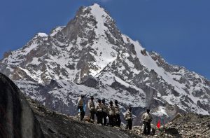 <p>Indian soldiers stand at a glacier near base camp of Siachen, India. Image source: UPI / Alamy</p>