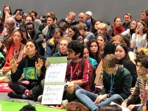 <p>Youth groups protest the lack of progress at 2019 UN climate talks inside the summit venue [image by: Joydeep Gupta]</p>