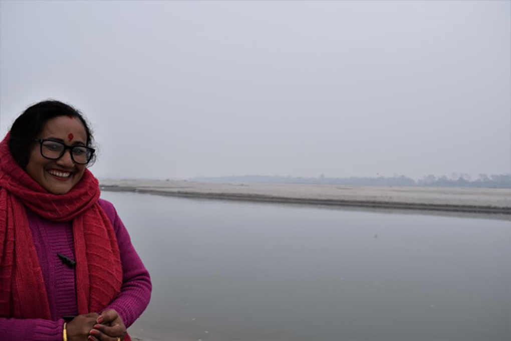 Purna Devi Kasera on the bank of the Mahakali, with the Shuklaphanta National Park across the river