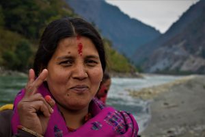 Tara Karki on the bank of the Mahakali, with India across the river [All images by: Minket Lepcha]
