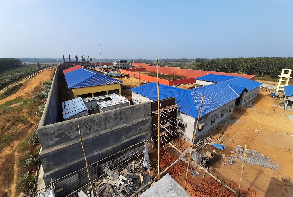 <p>Labourers build a detention centre in Goalpara, Assam, on  February 10, 2020. [image by: David Talukdar / Shutterstock.com]</p>