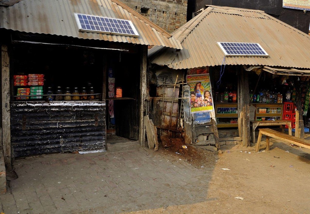 solar panels on the roof of shops. Solar and wind power innovations may allow for a "democratising" of energy resources desperately needed in the HKH region [image courtesy: ICIMOD]