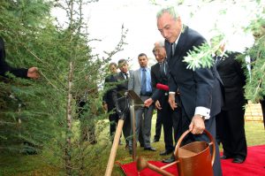 New interim Brazilian president Michel Temer watering trees. Under his watch, Brazil's congress is expected to approve a law weakenening environmental protection