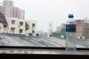 bottle of water placed on a window sill