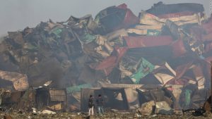 <p>This tangled heap of containers was created by the huge blasts that ripped through Tianjin&#8217;s port area in August 2015 (Image by 中敬記者集団)</p>
