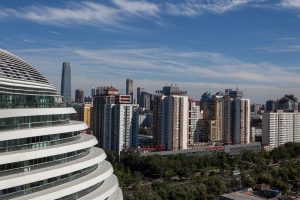 A view of Galaxy Soho, Beijing against a blue sky.