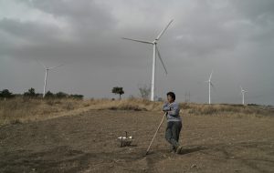 <p>Up on the hill you can hear the new turbines spinning in the strong breeze. Chen Fang, from the village of Taizigou, hopes the wind will bring rain so she can plant her seeds.​</p>