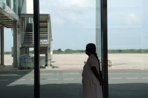 <p>A local tourist looks out onto an empty runway at Sri Lanka&#39;s Mattala Rajapaksa International Airport near Hambantota (Image: Chathuri Dissanayake)</p>
