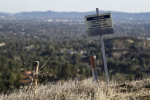 California's unhappy valley. signpost with the words 'Caution: gas pipeline'.A huge leak of methane over the past few months from a natural gas storage site is equivalent to a quarter of the state's GHG emissions