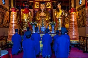 Confucianism and Daoism: Taoist monks praying at The City God Temple (Chenghuang Miao Temple) in Shanghai (Image: Alamy)