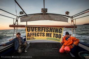 sign on a boat with the words 'overfishing affects me too'