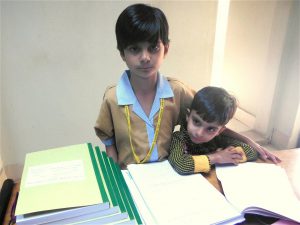 <p>Rabab Ali, with her younger brother (Image courtesy Qazi Ali Athar)</p>