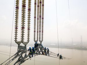 <p>The Changji-Guquan ultra-high voltage transmission link along the Yangtze River (Image: Alamy)</p>