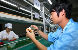 a smartphone factory worker