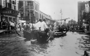<p>Rickshaw pullers working the flooded streets</p>