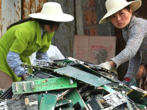 Chinese woman dismantling electronic computer