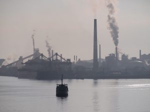 Factory in China. The environmental impacts of mining and transportation of coal, as well as its impact on public health, are not included in its cost, creating an unfair advantage over renewables (Image by atuweb)
