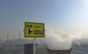 pm 2.5 warning sign near coal plant