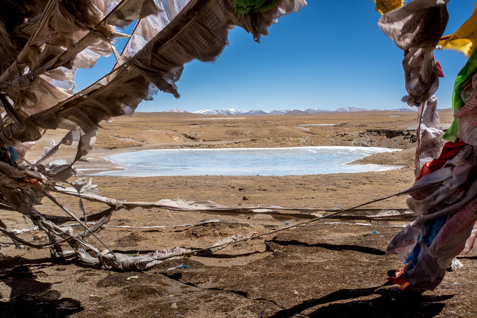 <p>A frozen pool that is part of the Lasagongma Springs – the source of the Mekong River. (Image: Luke Forsyth)</p>