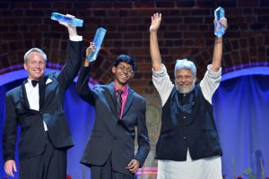 <p>Perry Alagappan, pictured centre, scooped an award for a US$20 water filter that removes poisonous compounds from electronic waste. (Image by&nbsp;Jonas Berg / World Water Week)</p>