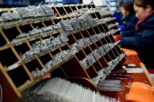 Workers sort mercury thermometers in Jiangsu province