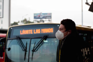 <p>A passenger on Bogotá&#8217;s Transmilenio BRT system, which has been slow to replace diesel buses with electric equivalents (image: Alamy)</p>