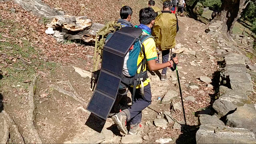 Solar panels on a backpack while trekking [image courtesy: Harshvardhan Joshi]