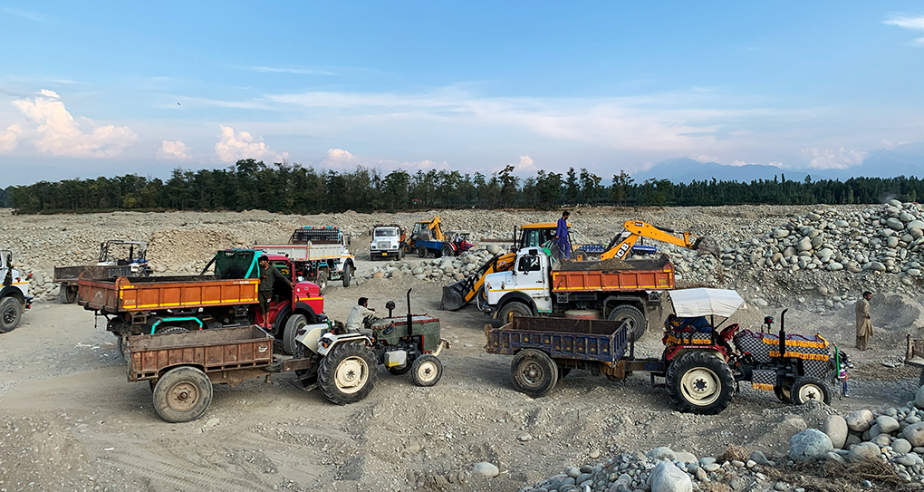 <p>Residents near the Rambi Ara, a tributary of the River Jhelum in Tahab, Jammu and Kashmir, say truckloads of minerals are being extracted from the river every day (image by: Shabir Bhat)</p>