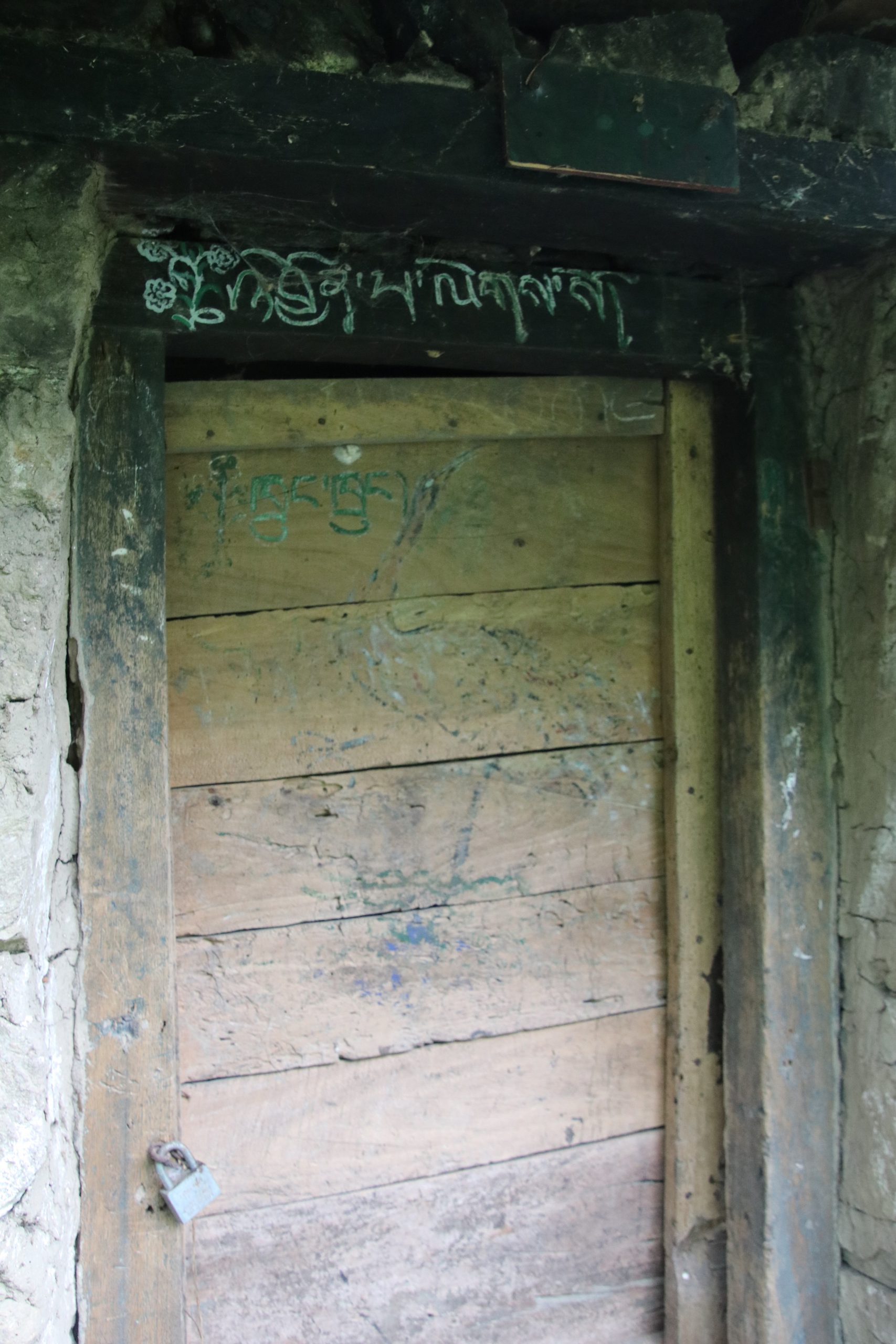 A welcome note written above the door of a house in Shamdoley, Dagana
