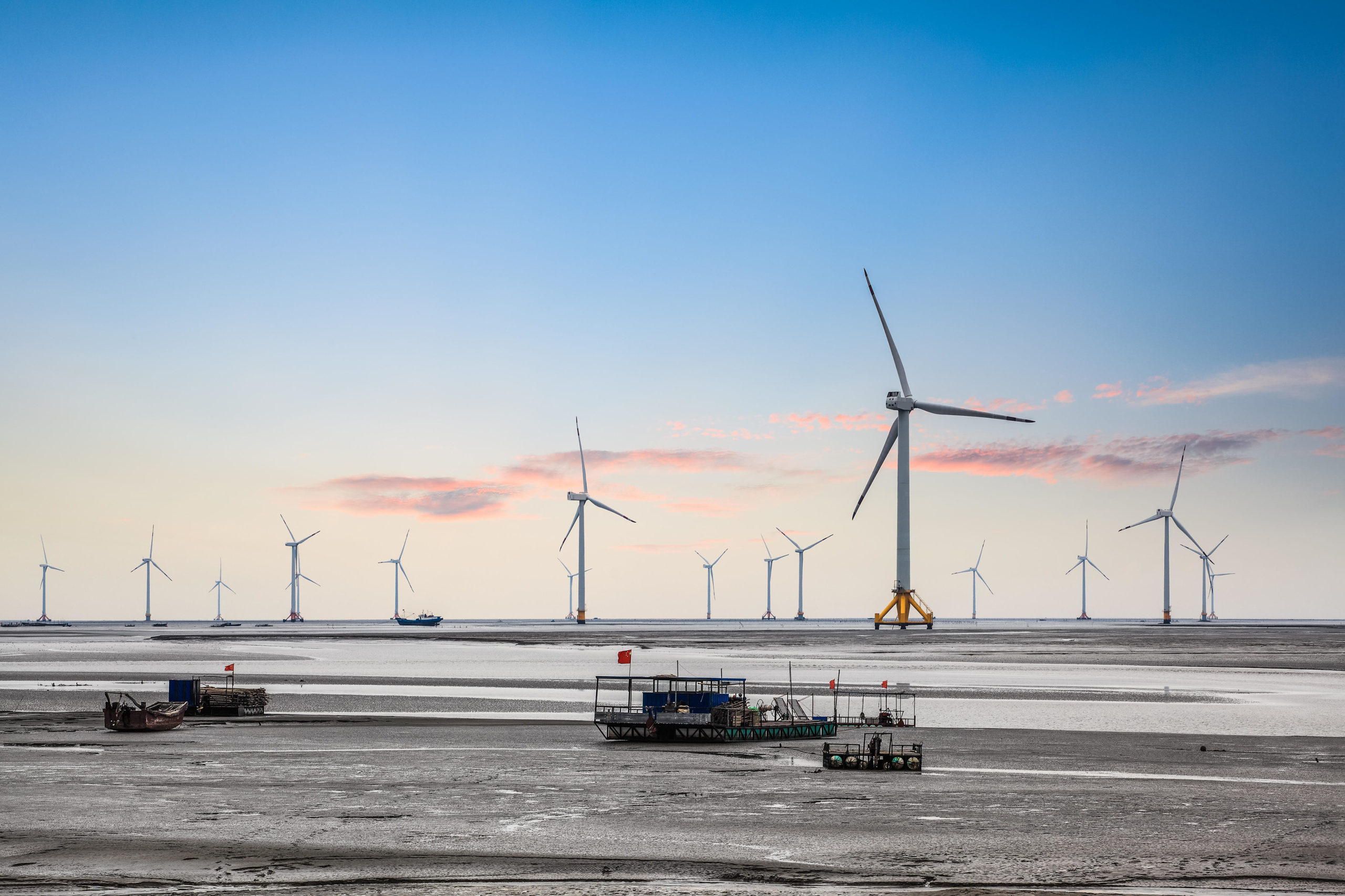 <p>An offshore wind farm in China (Image: Zhang Zhiwei / Alamy)</p>